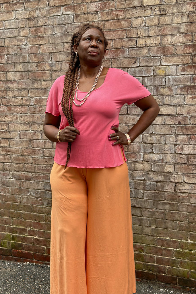 palazzo pant in tissue peach styled with the sola t in tissue berry