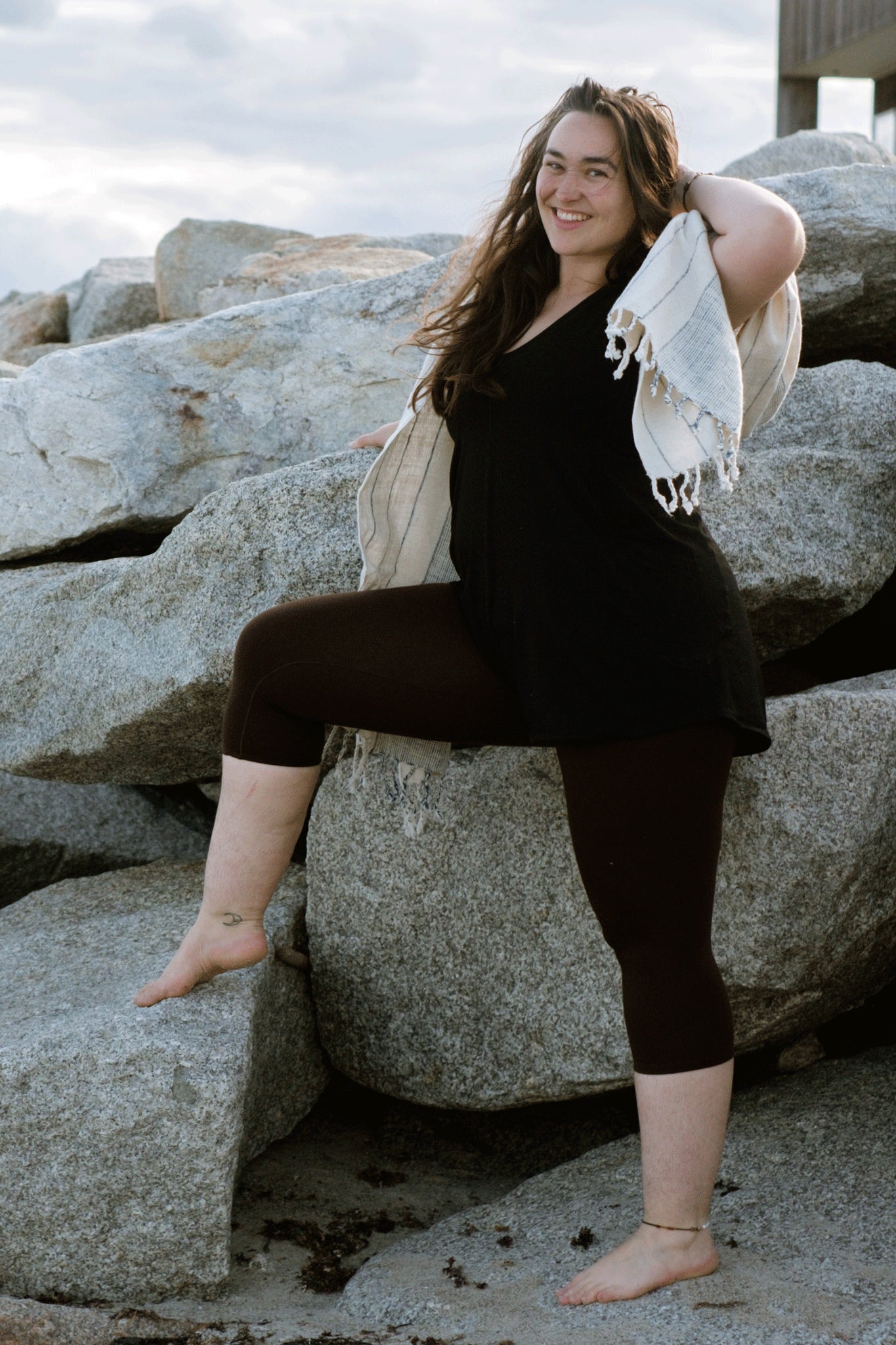 sprout romper in black with peat capri layered under