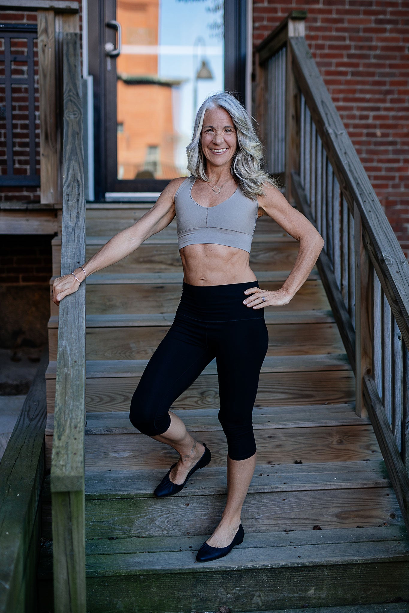 balance bra in clay styled with black capri