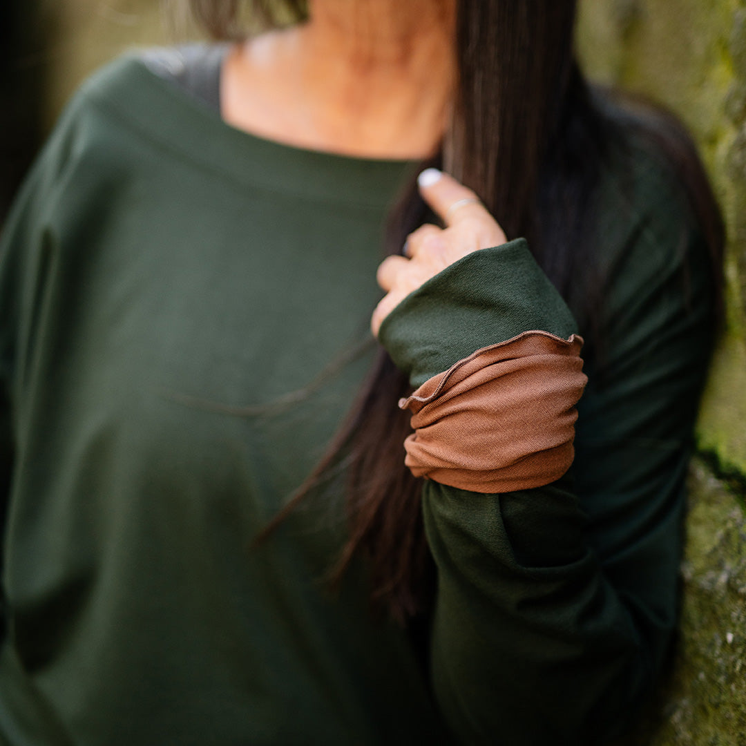 the band in cedar on the wrist with welder top in fir