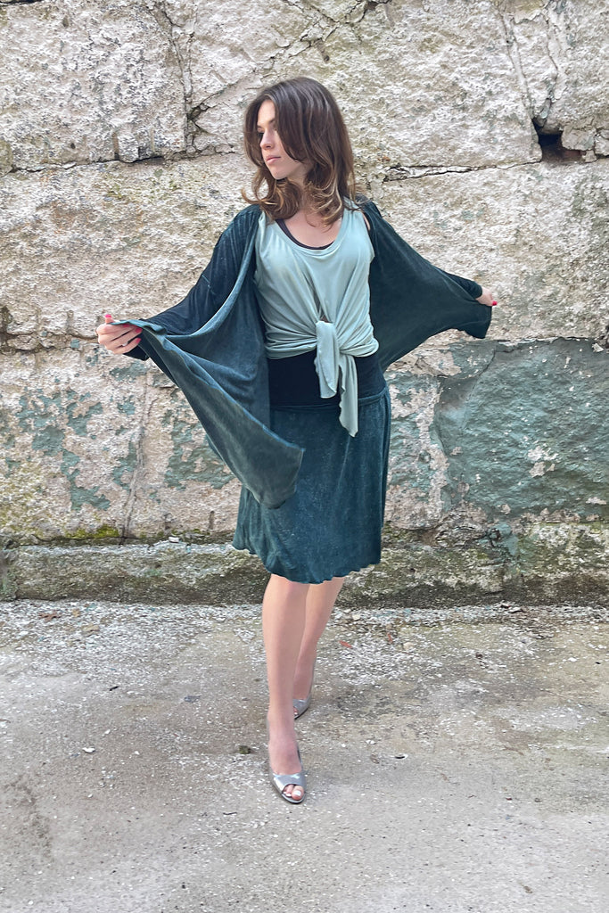 prima wrap jacket in blue mineral worn over glass tulip tank and blue mineral flirt as a skirt