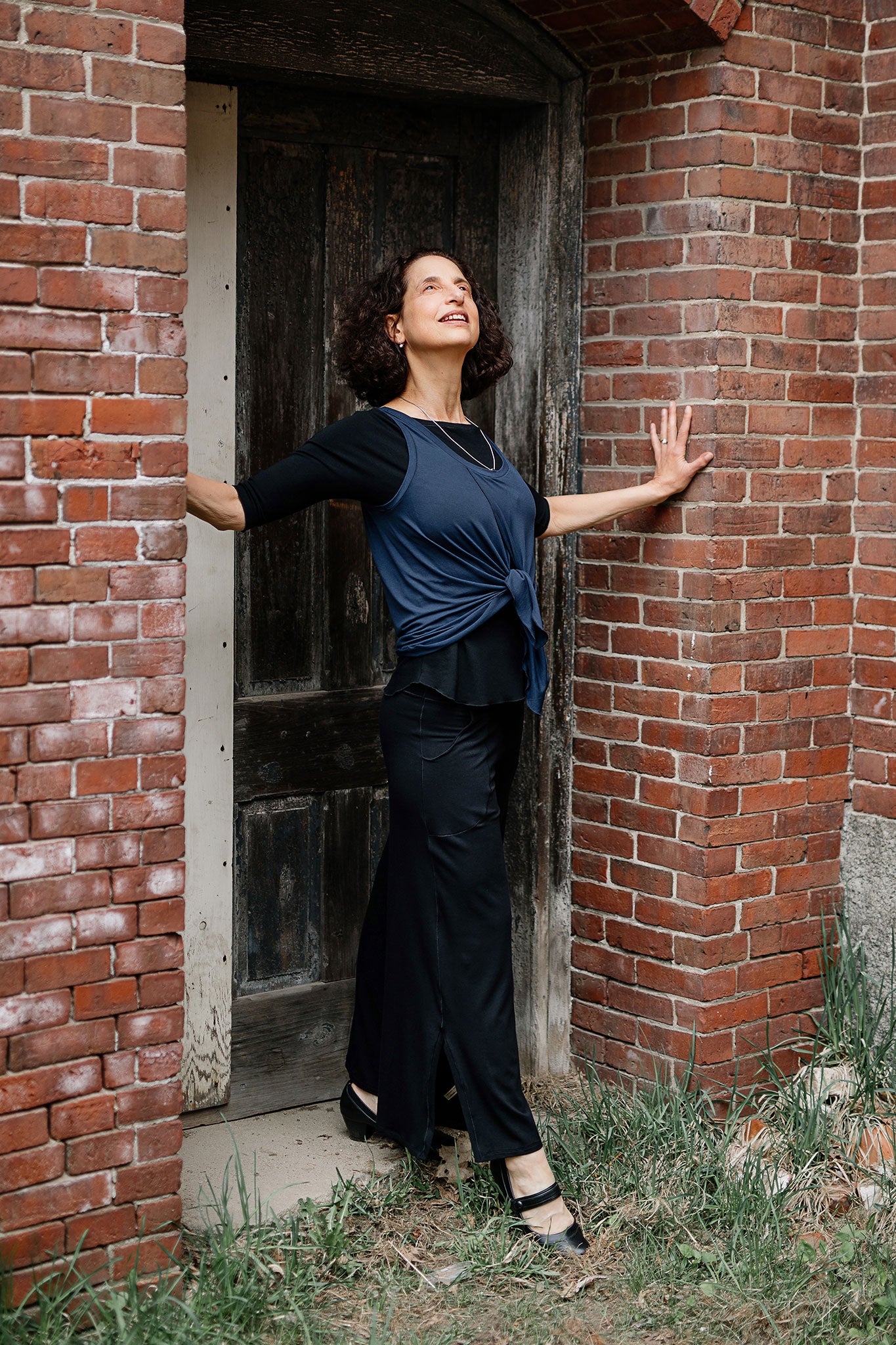 tulip tissue tank in navy worn backwards tied in front