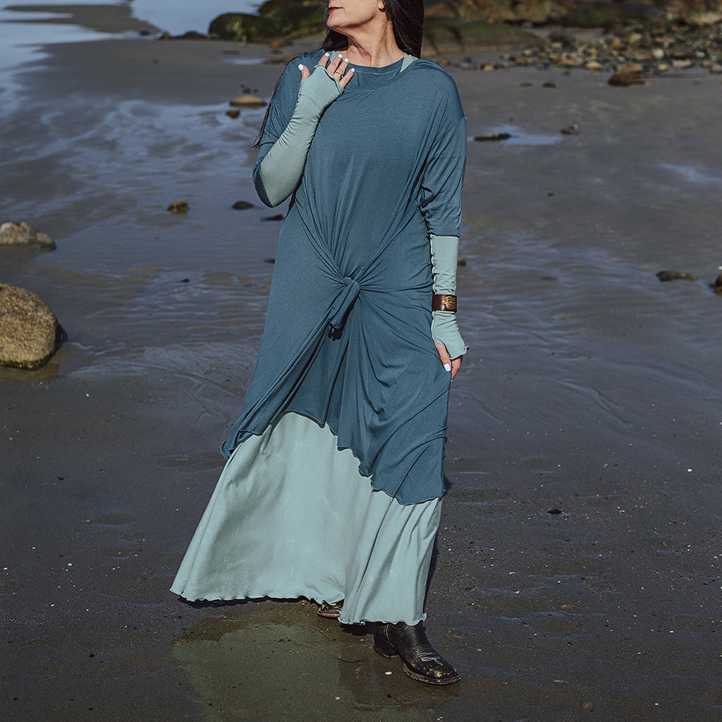 tide dress in ocean worn over glow gown in glass with glass opera sleeves