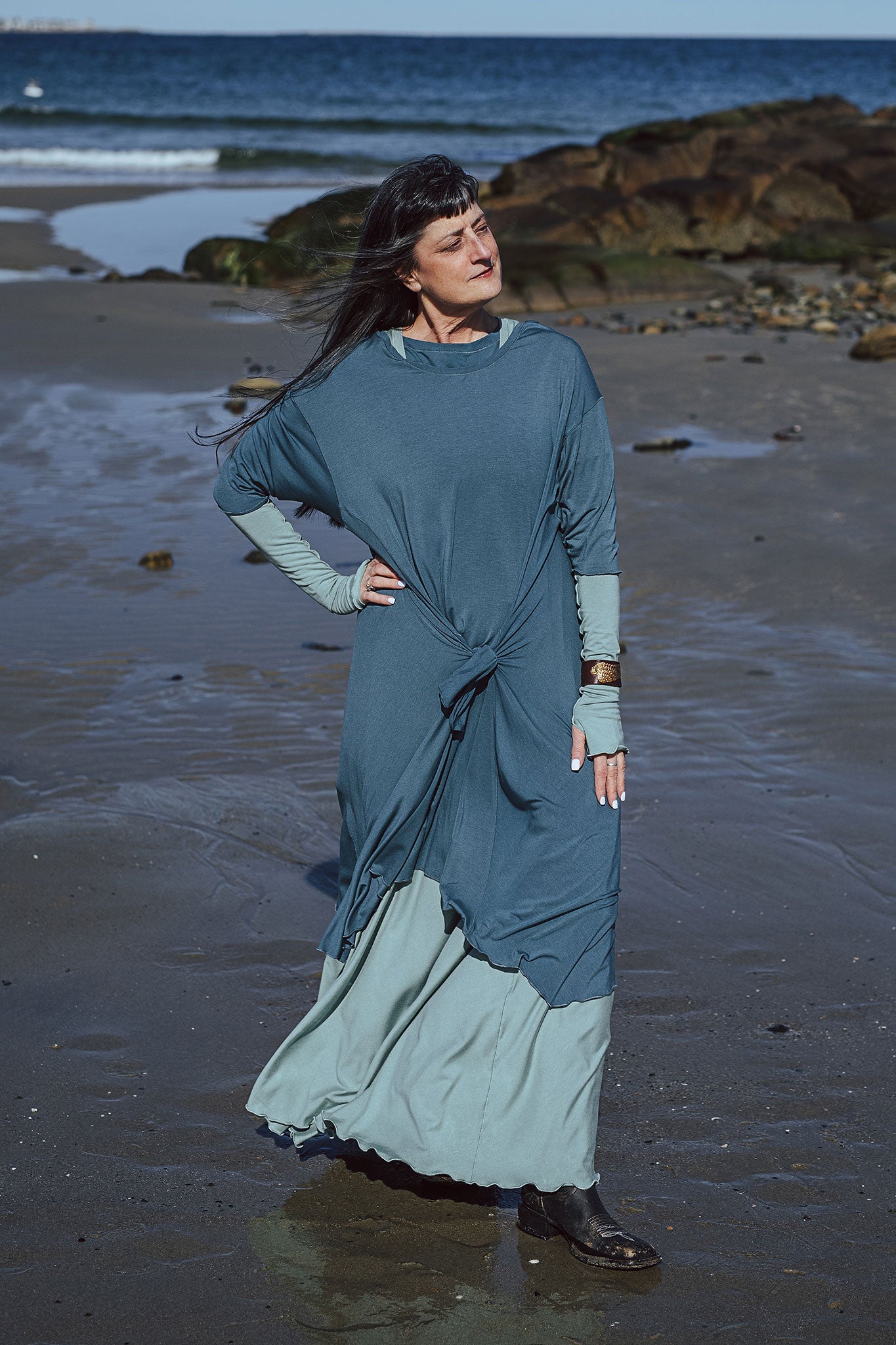 tide dress in ocean worn over glow gown in glass with glass opera sleeves