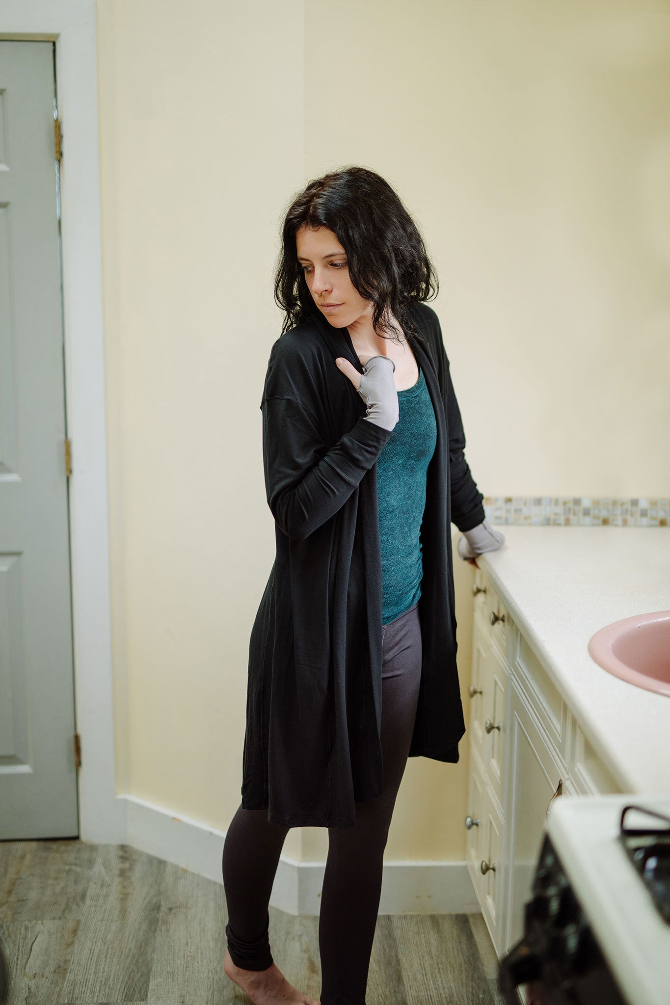 coco blazer in black paired with blue mineral core tank and carbon base legging