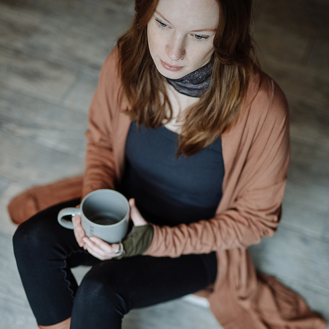 coco blazer in cedar paired with black playsuit, carbon core tank, and cedar stockings