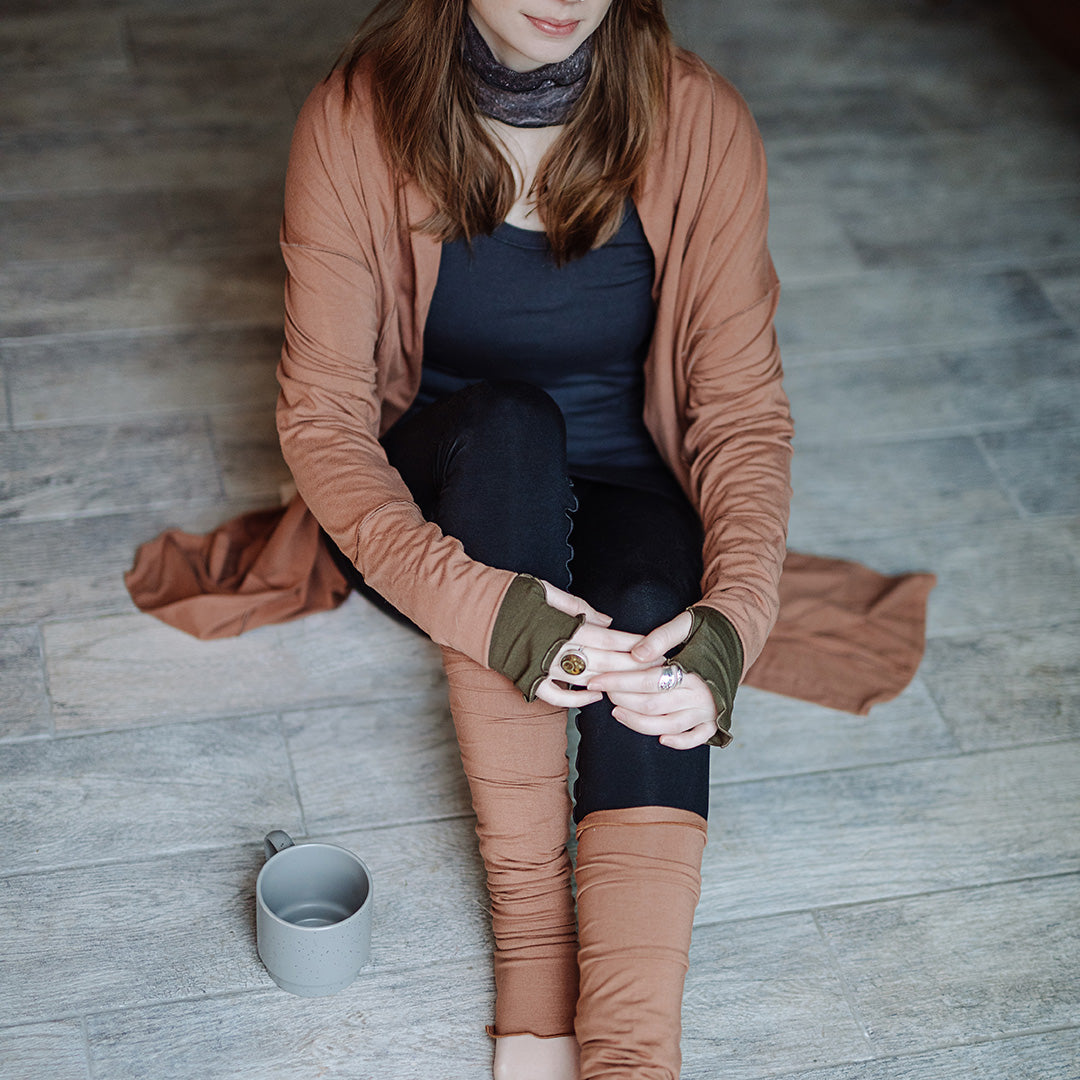 coco blazer in cedar paired with black playsuit, carbon core tank, and cedar stockings