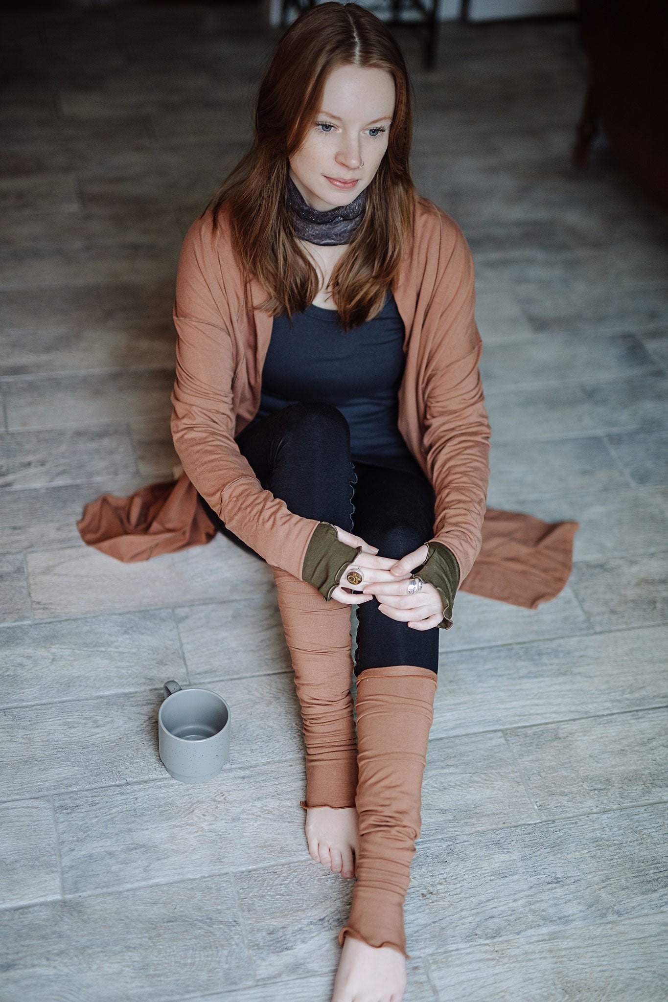 coco blazer in cedar paired with black playsuit, carbon core tank, and cedar stockings