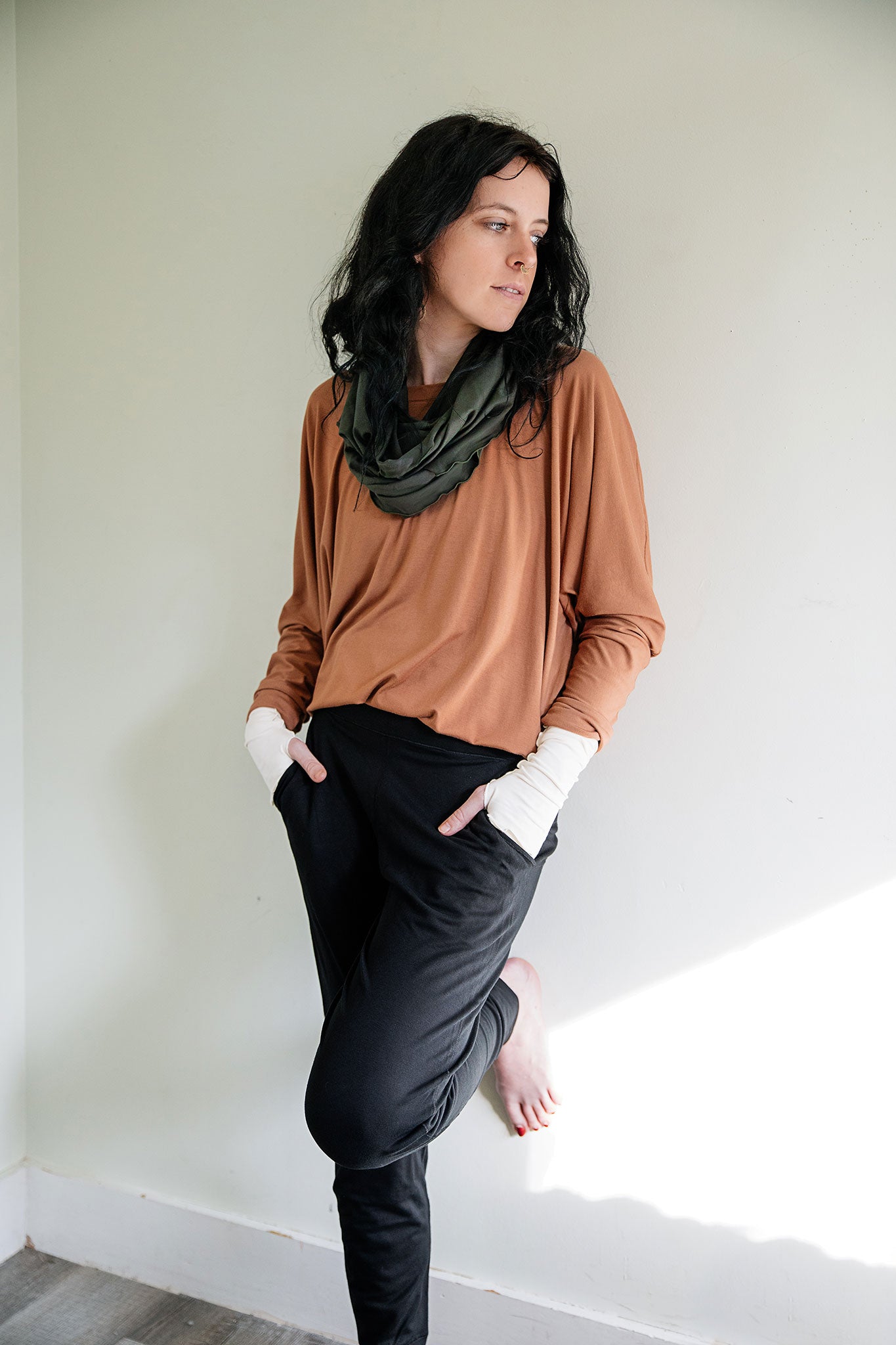 jogger sweatpant in black paired with poptop in cedar and fir loop around neck