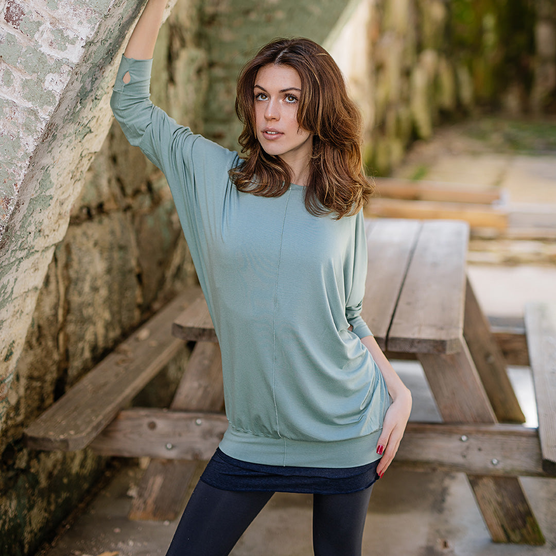 pop top in glass layered over hourglass in midnight worn as a skirt and base legging in carbon