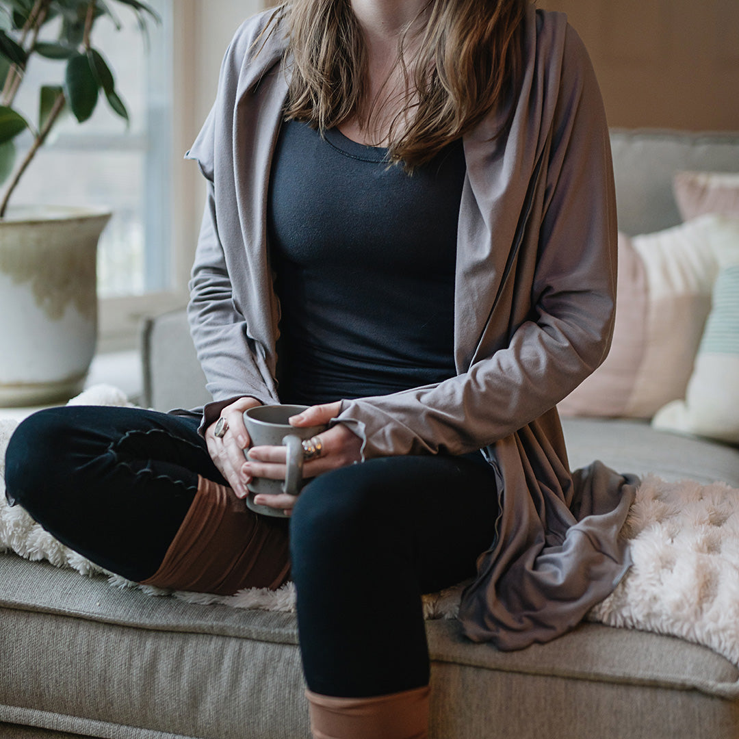 core tank in carbon with cardi jacket in moon, playsuit in black, and stockings in cedar