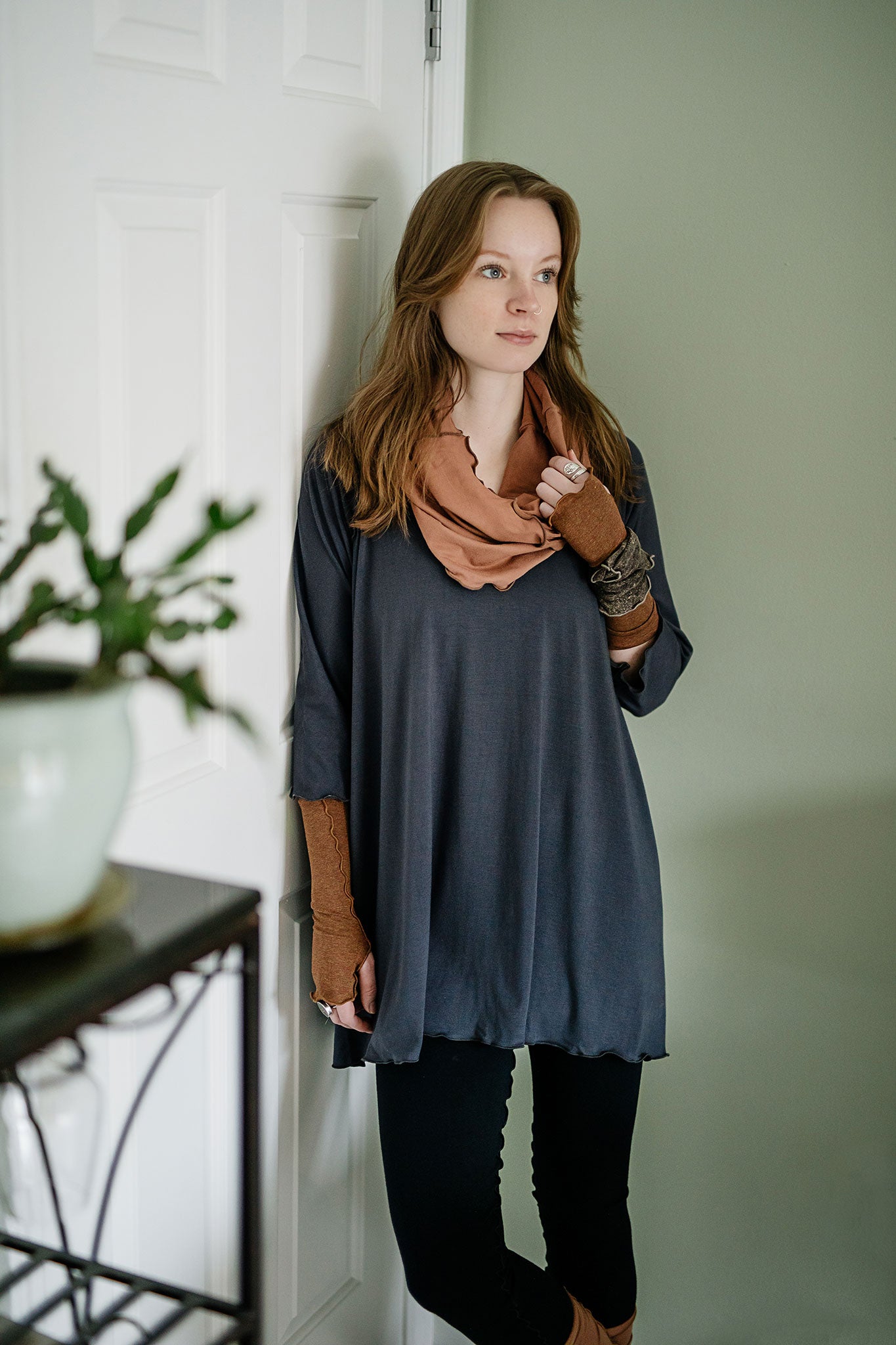 swing top in carbon paired with black playsuit, cedar hourglass around neck, and almond aria gloves