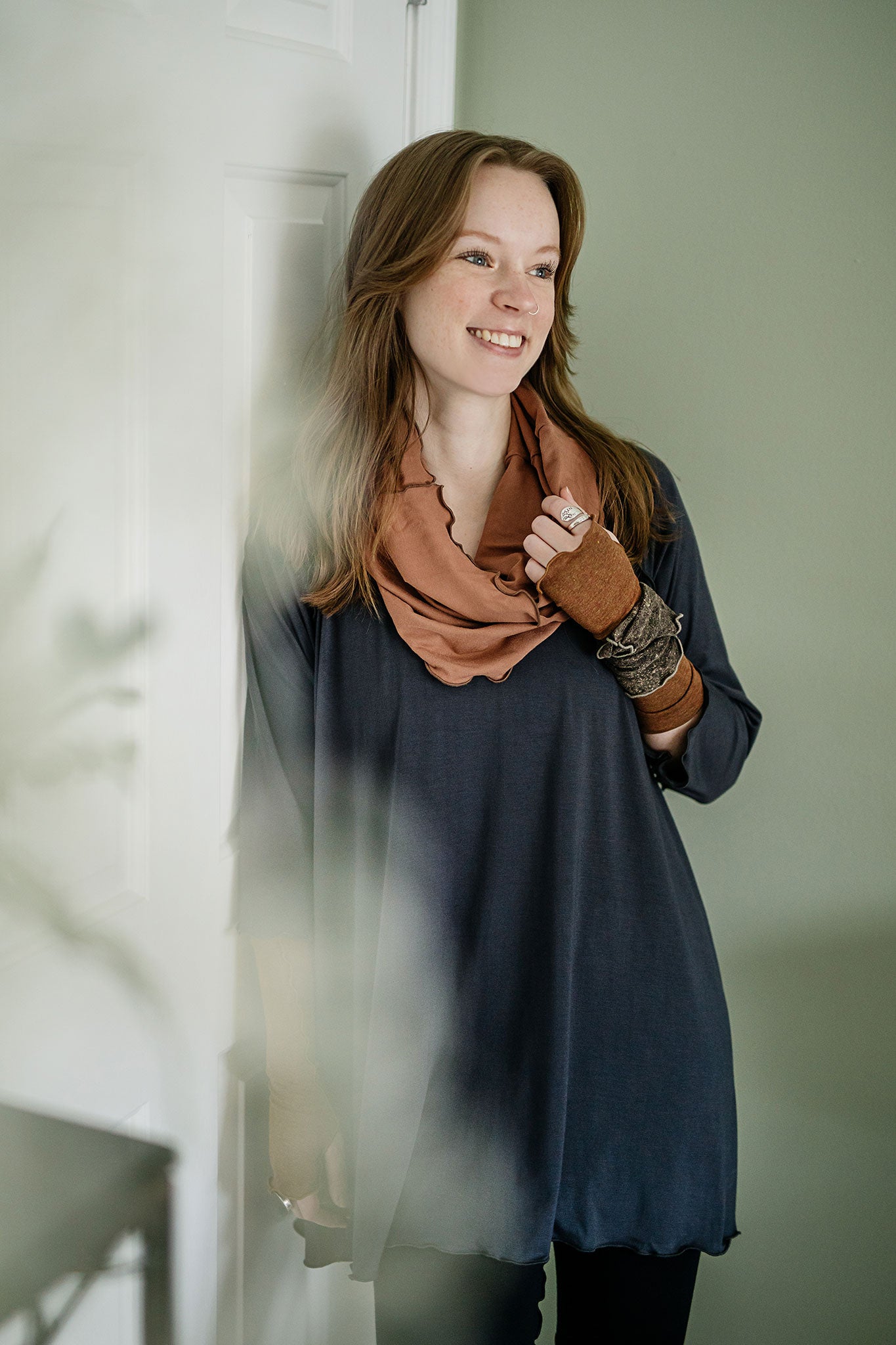 swing top in carbon paired with black playsuit, cedar hourglass around neck, and almond aria gloves