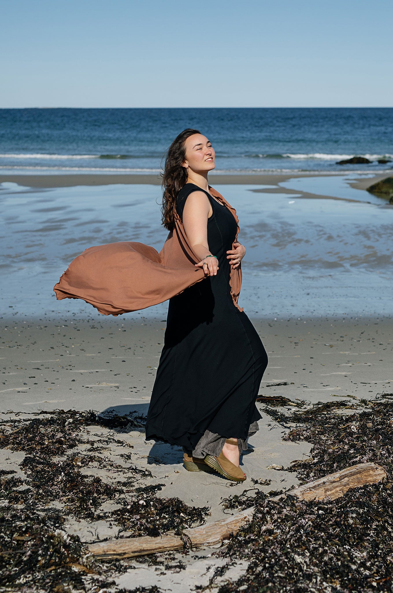 glow gown in black worn with shawl in cedar