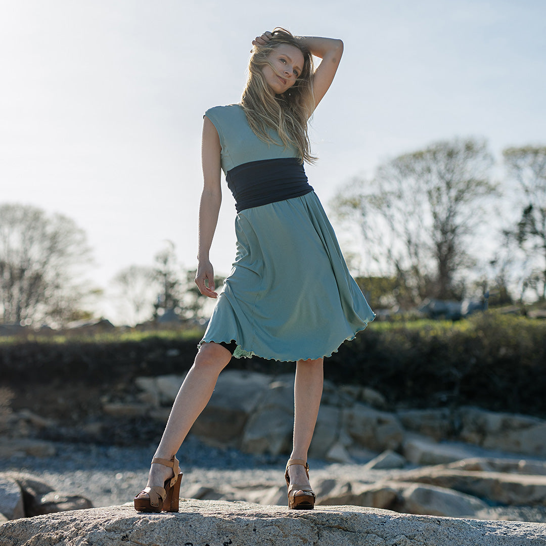 glow dress in glass with navy corset as a waist cincher