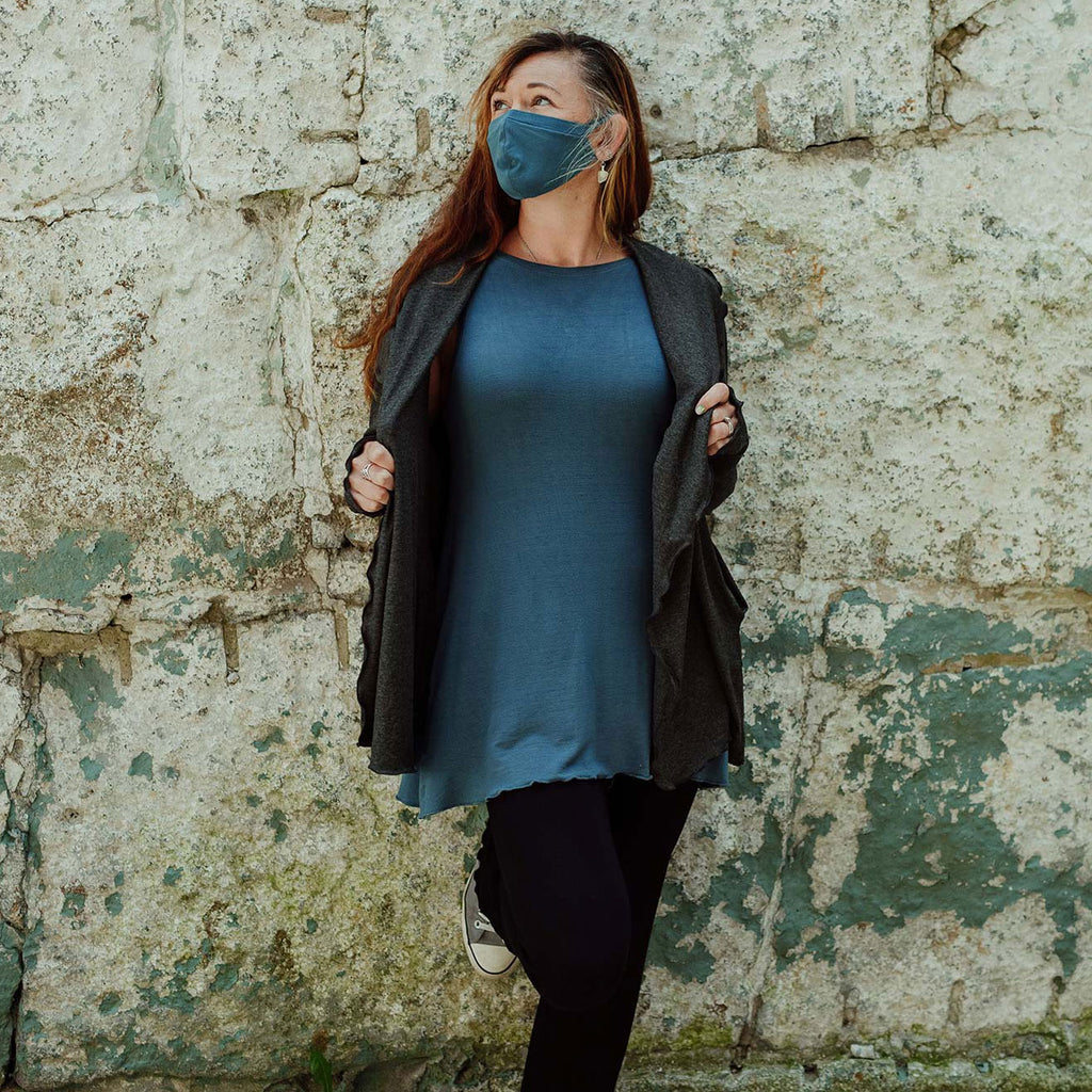 whisper mask + daisy tunic in ocean paired with river jacket in charcoal