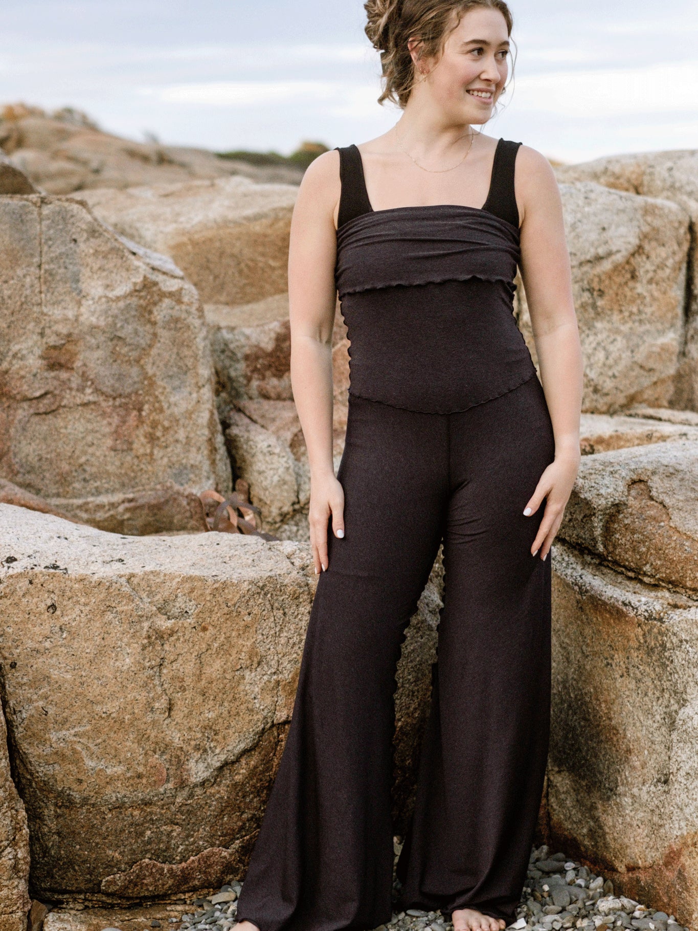 suger® swirlsuit in midnight pulled over the black full support