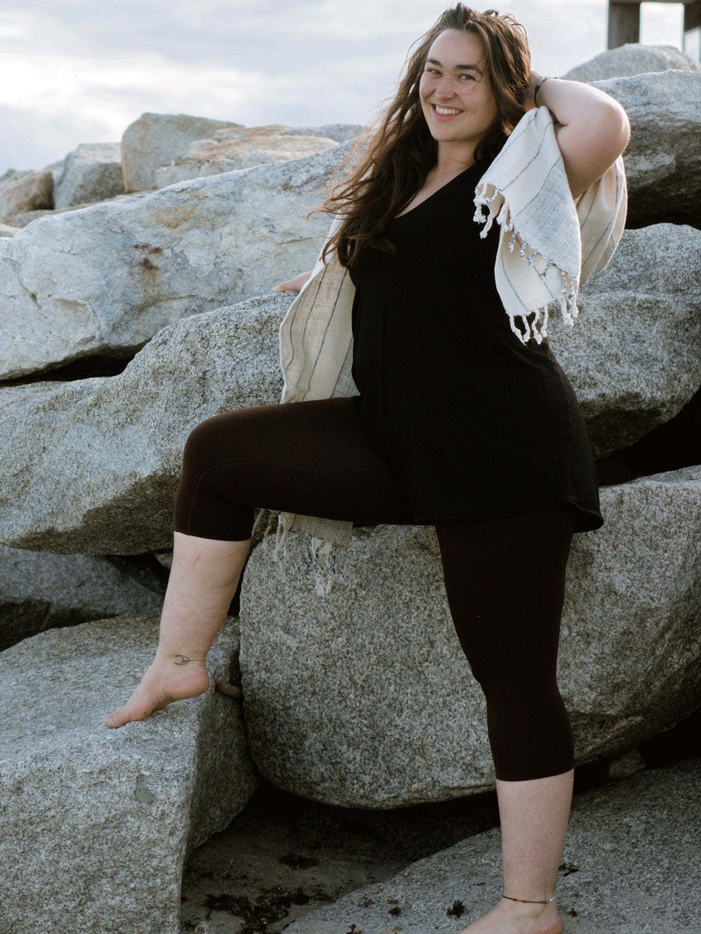 sprout romper in black with peat capri layered under