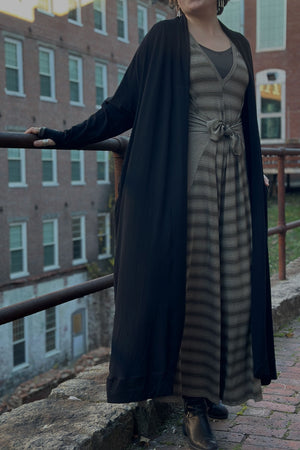 farmer in country stripe with black duster