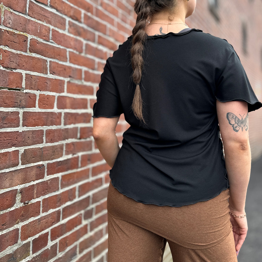 sweet t in black worn with almond swirlsuit