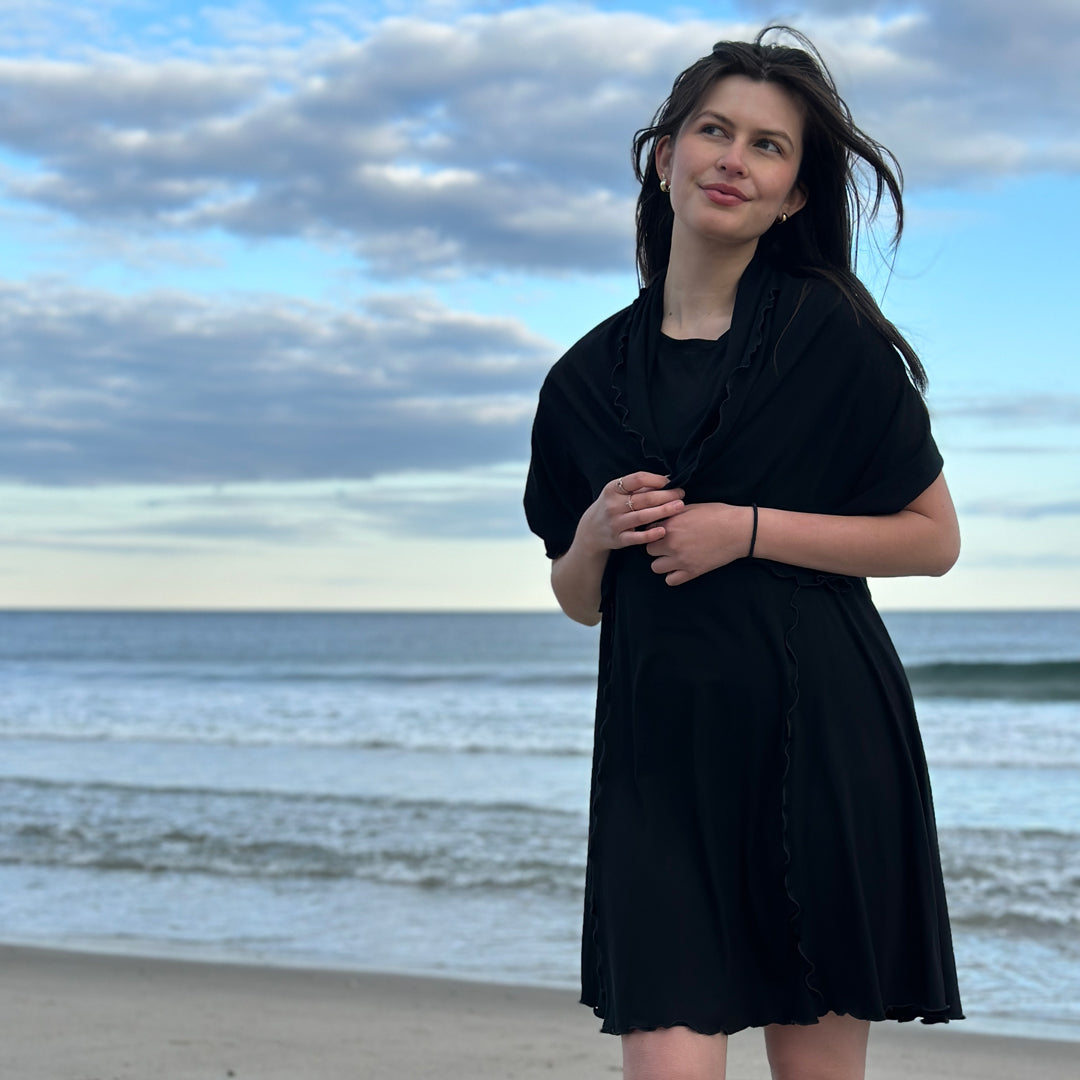 angelrox® dahlin' dress in black pulled onto shoulder