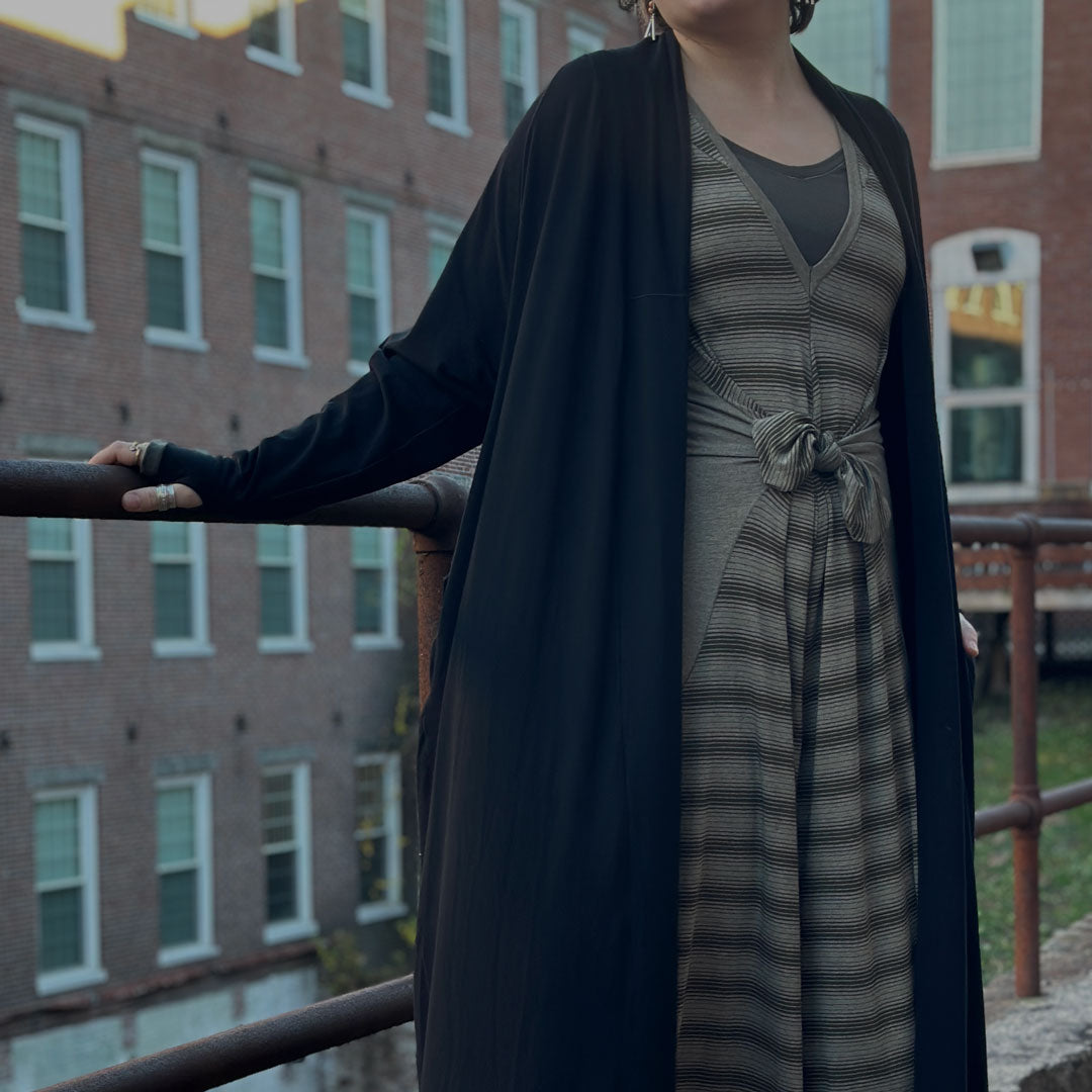 country stripe farmer in country sage tied at the waist with the black duster