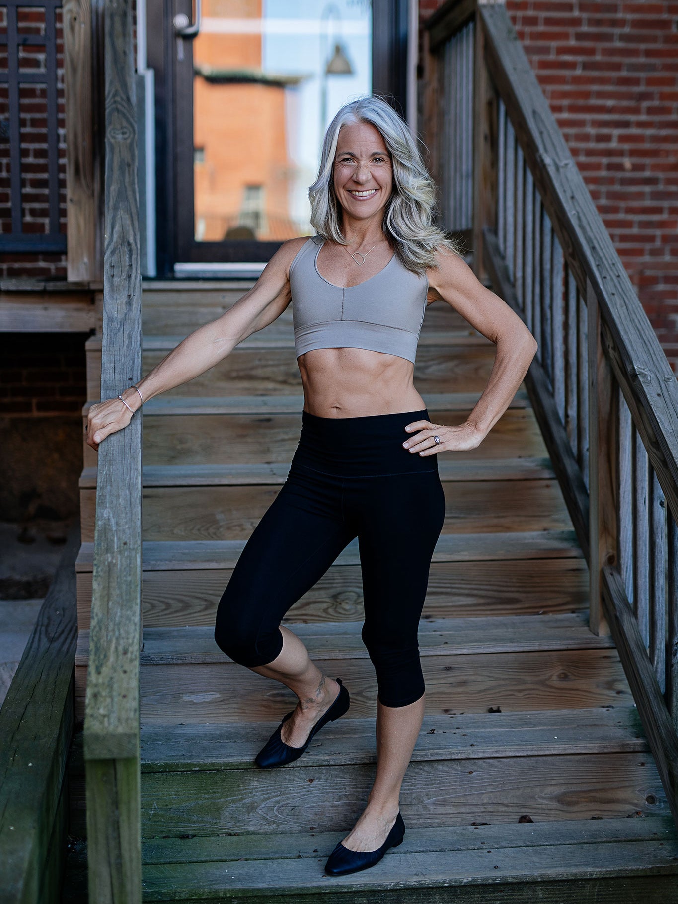 balance bra in clay styled with black capri