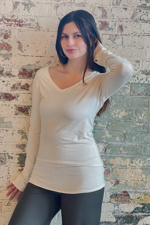 bamboo milk vneck long sleeve top with fir swirlsuit on bottom