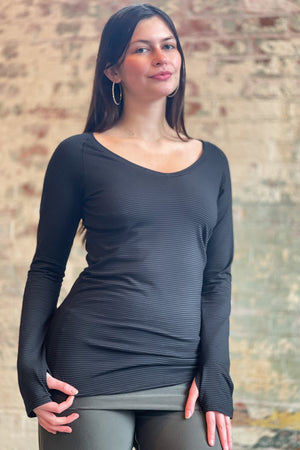 bamboo subtle black vneck long sleeve top with fir swirlsuit on bottom