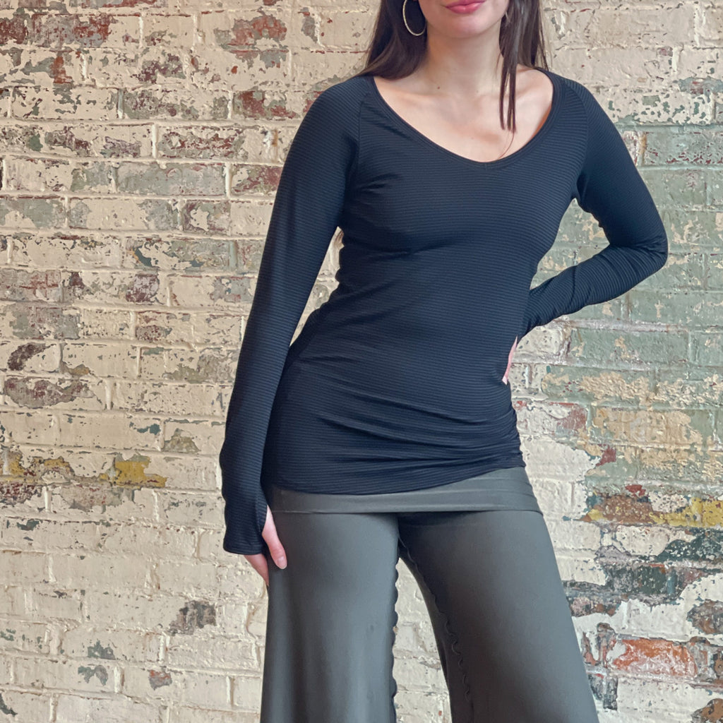 bamboo subtle black long sleeve top with fir swirlsuit on bottom.