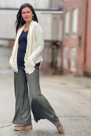 suger® swirlsuit in fir + subtle black vneck + milk cardi