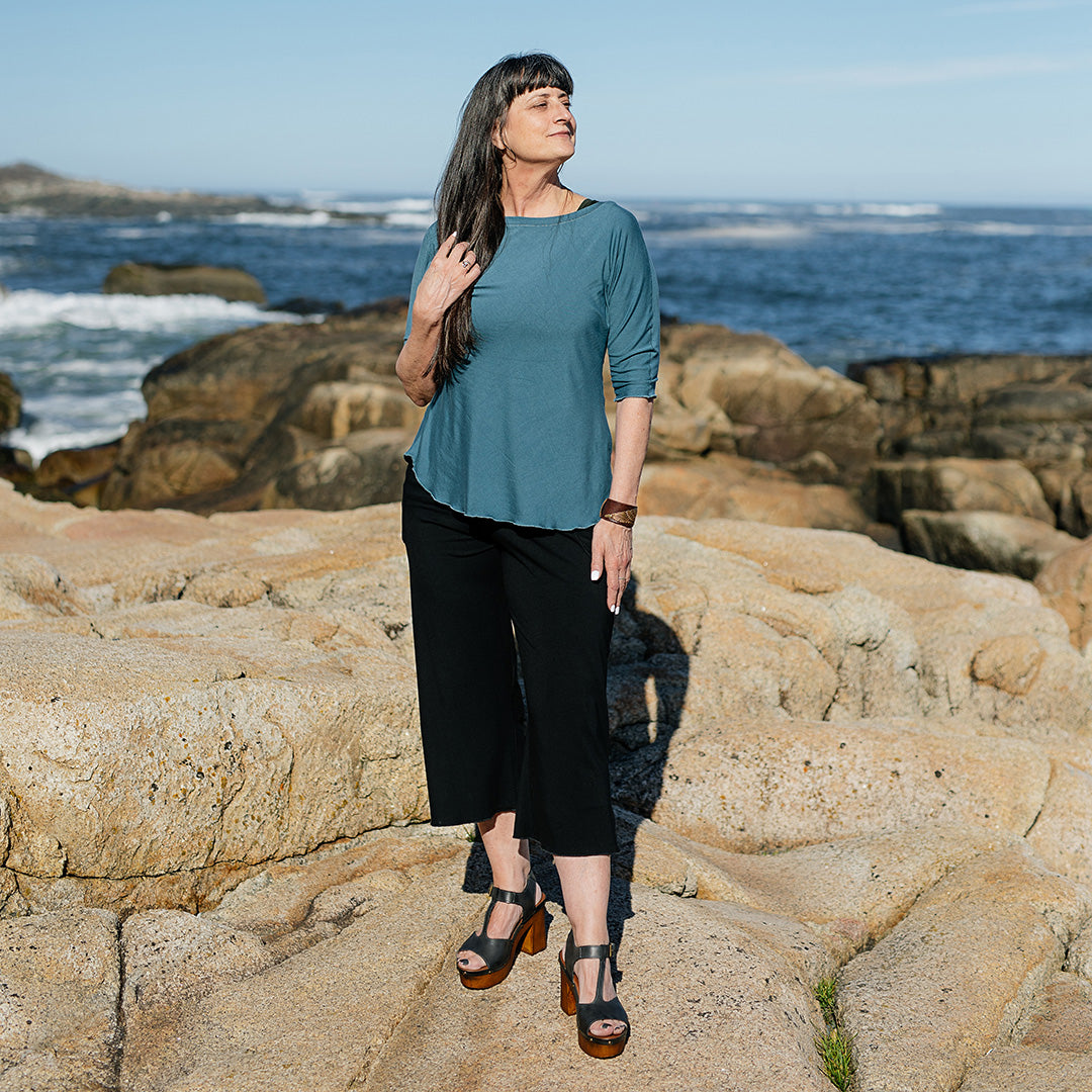 kick yoga pant in black styled with ocean rose top