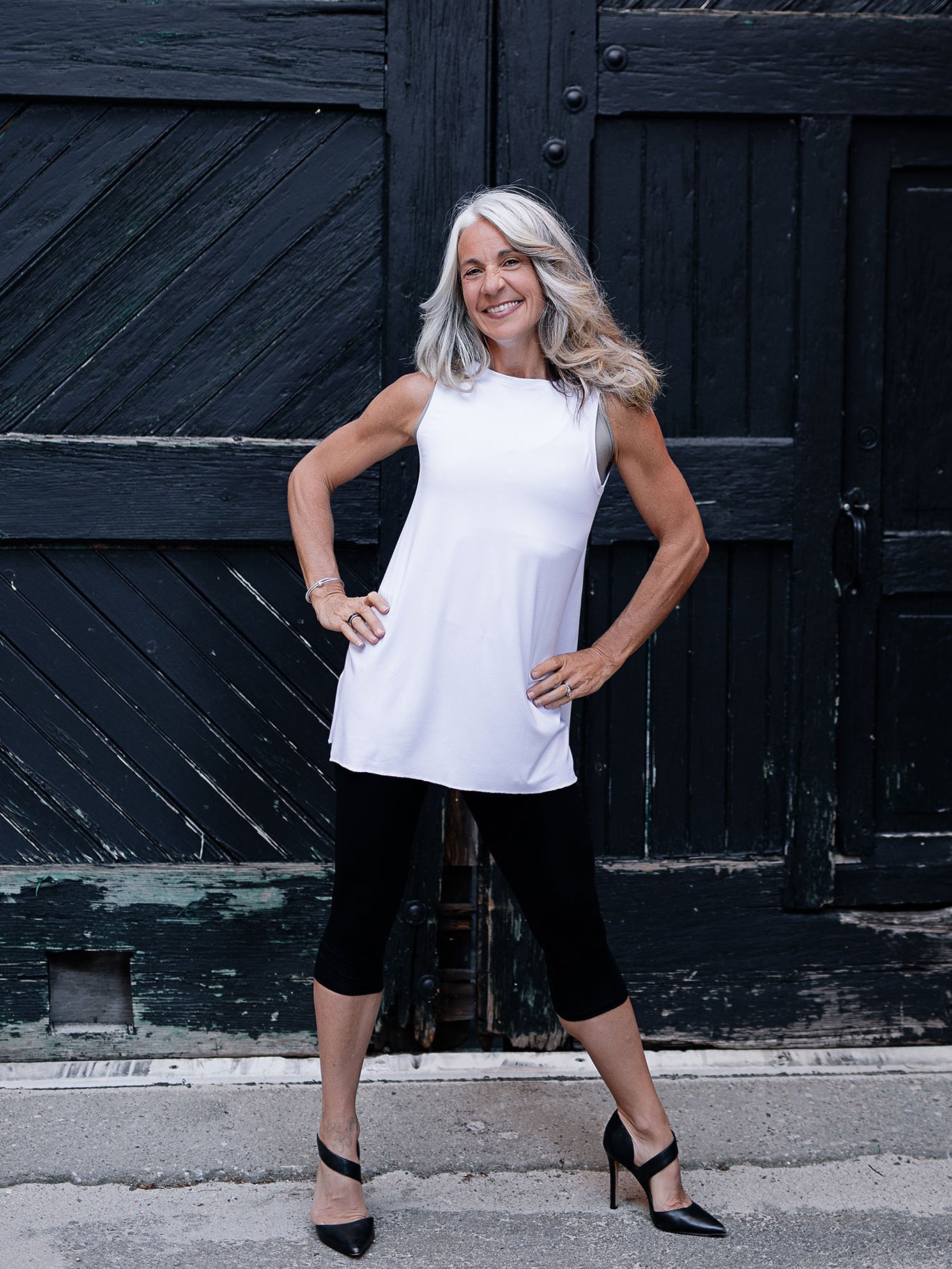 daisy tunic tank in white styled with black capri