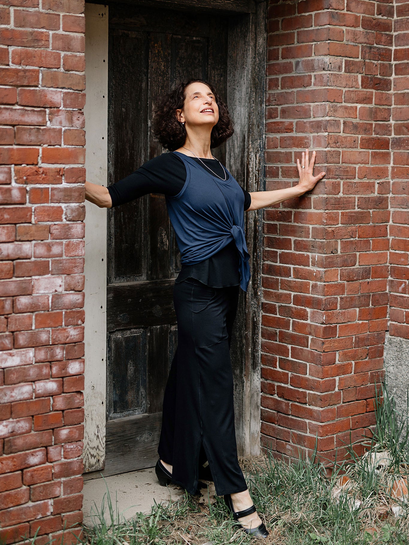 tulip tissue tank in navy worn backwards tied in front