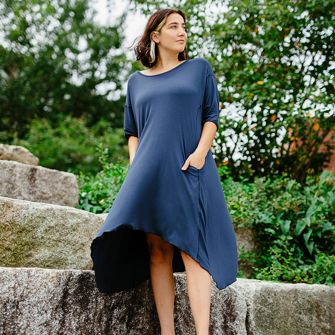 tide dress in navy has quarter length sleeves + deep pockets