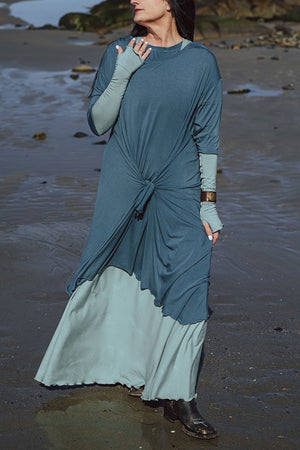 tide dress in ocean worn over glow gown in glass with glass opera sleeves