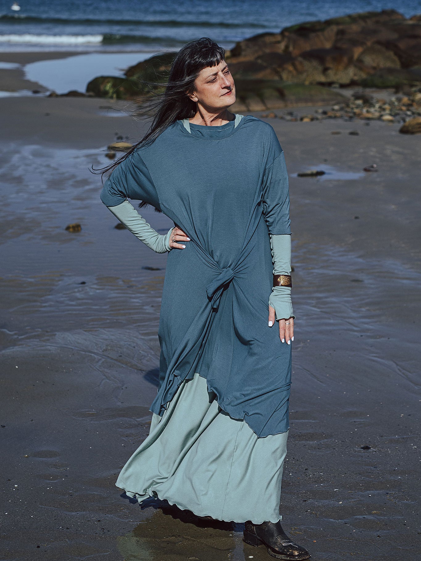 tide dress in ocean worn over glow gown in glass with glass opera sleeves