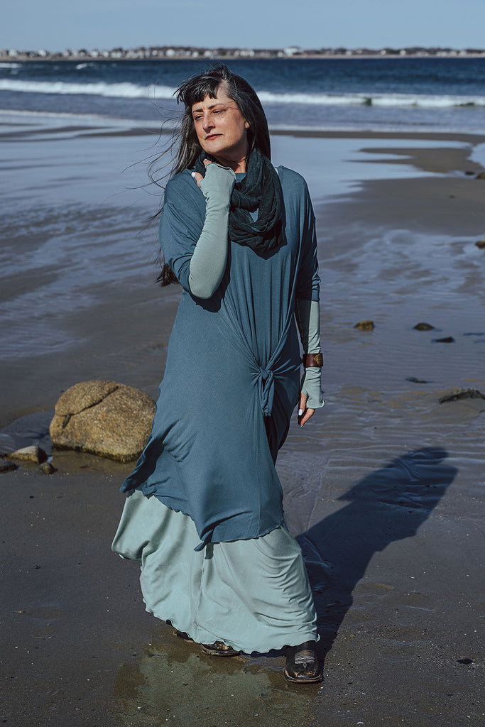 tide dress in ocean worn over glow gown in glass with glass opera sleeves and blue mineral loop