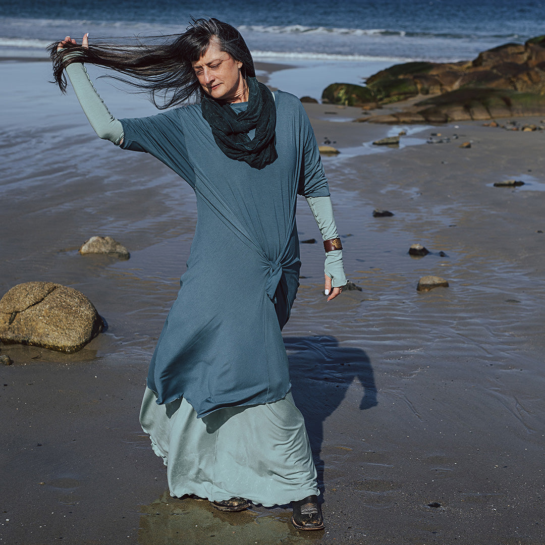 tide dress in ocean worn over glow gown in glass with glass opera sleeves and blue mineral loop