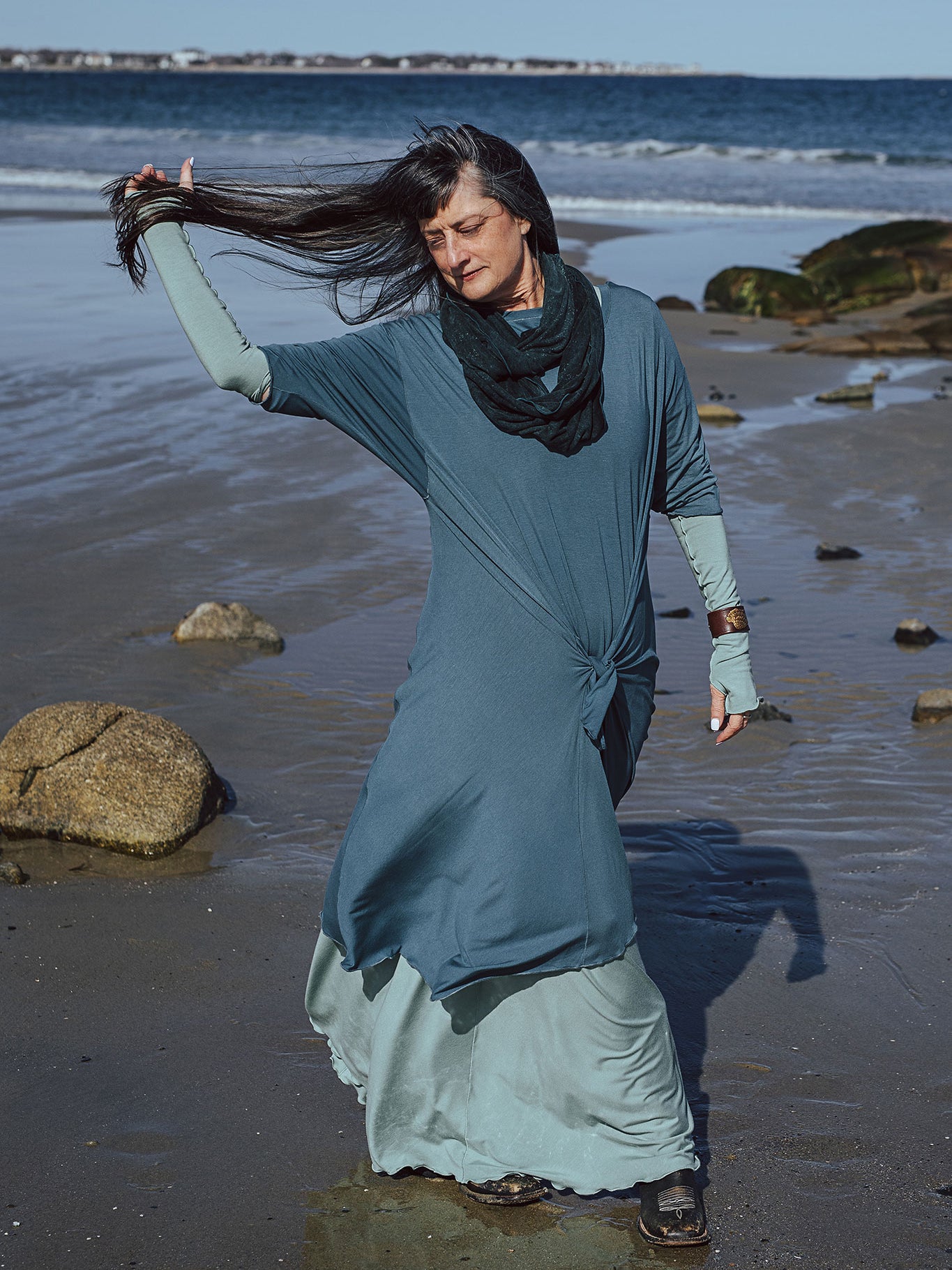 tide dress in ocean worn over glow gown in glass with glass opera sleeves and blue mineral loop