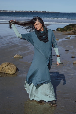 tide dress in ocean worn over glow gown in glass with glass opera sleeves and blue mineral loop