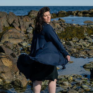 garden coat in navy worn with glow dress in black