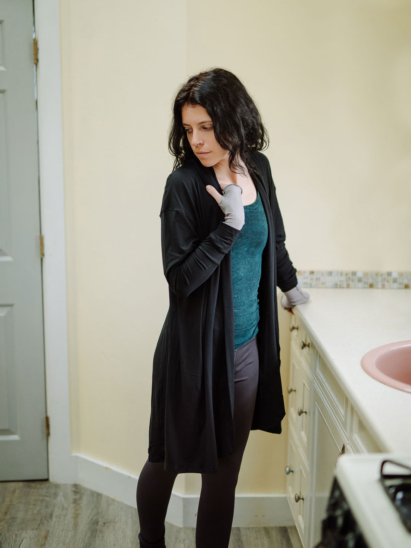 coco blazer in black paired with blue mineral core tank and carbon base legging