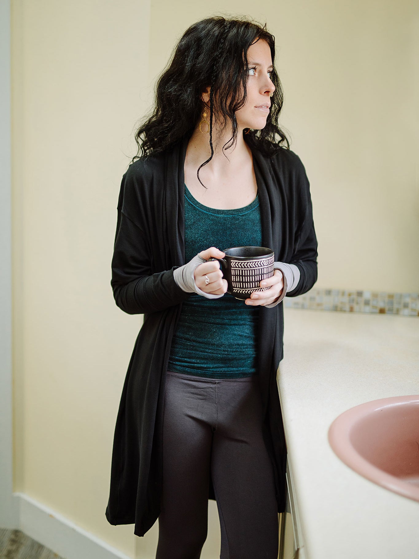 coco blazer in black paired with blue mineral core tank and carbon base legging