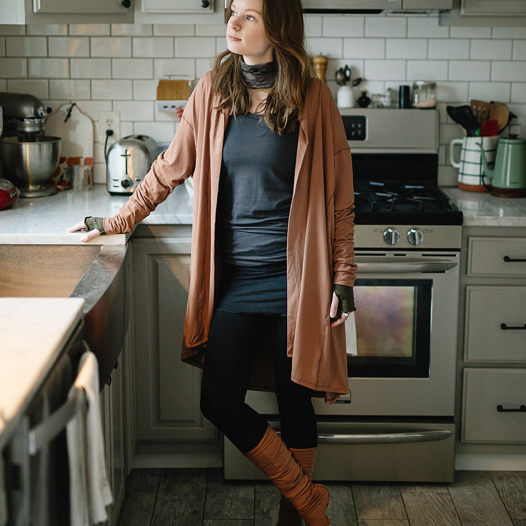 coco blazer in cedar paired with black playsuit, carbon core tank, and cedar stockings