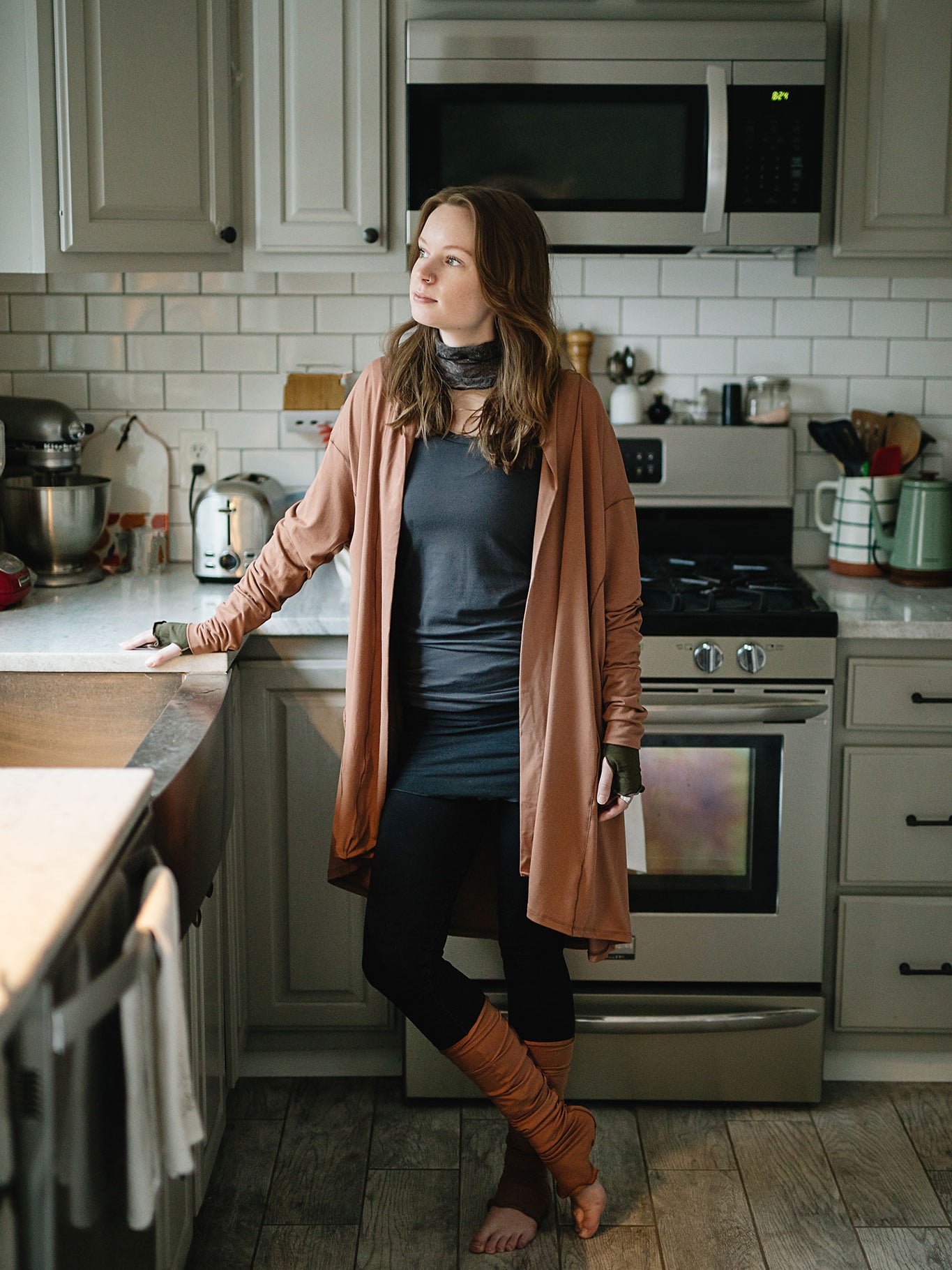 coco blazer in cedar paired with black playsuit, carbon core tank, and cedar stockings