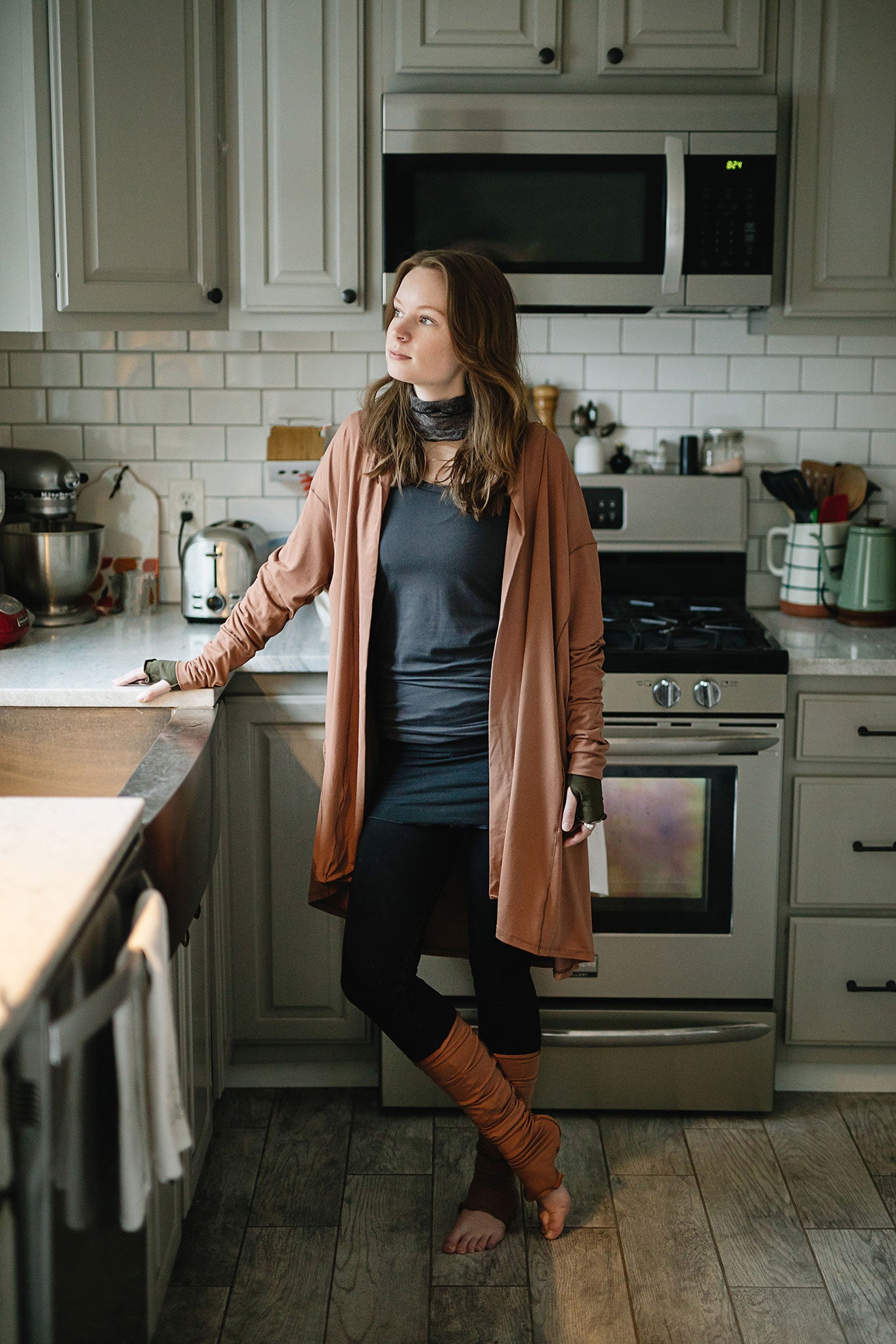 coco blazer in cedar paired with black playsuit, carbon core tank, and cedar stockings