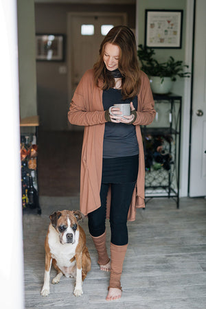 playsuit in black with top section folded over into a skirt; paired with coco jacket in cedar, cedar stockings, and core tank in carbon