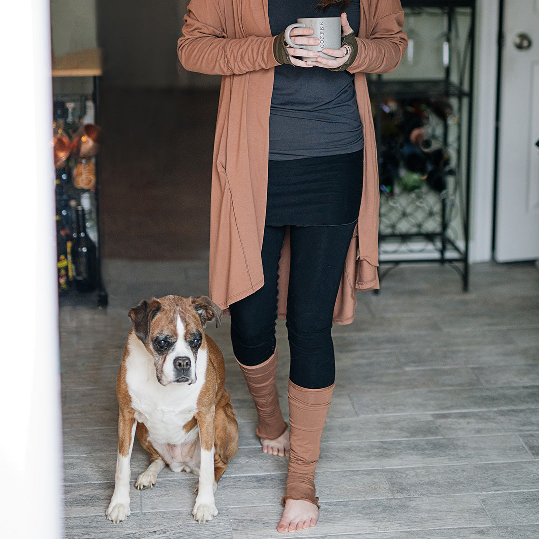 playsuit in black with top section folded over into a skirt; paired with coco jacket in cedar, cedar stockings, and core tank in carbon