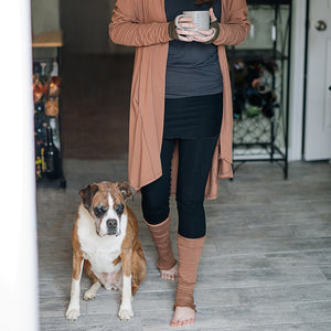 playsuit in black with top section folded over into a skirt; paired with coco jacket in cedar, cedar stockings, and core tank in carbon